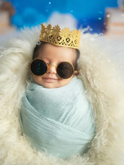 A close up of our cool little prince, rocking his sunglasses with a tiny smile. This shot is full of personality.