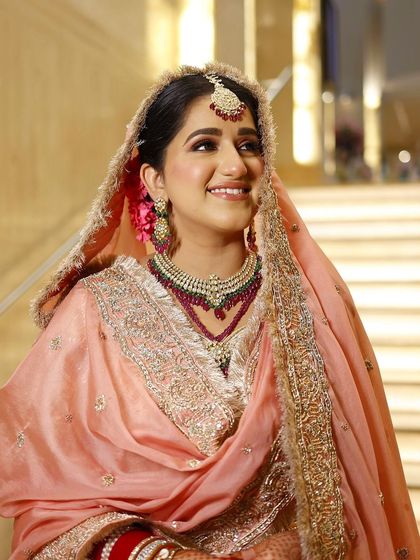 Starting the wedding season with a radiant and refreshing peach bridal look. This makeup is minimal yet magical, perfect for a day wedding.