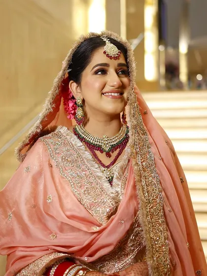 Starting the wedding season with a radiant and refreshing peach bridal look. This makeup is minimal yet magical, perfect for a day wedding.