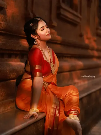 Bathed in the warm glow of the setting sun, this portrait has a magical quality. The bride's serene expression and the beautiful light create a truly memorable image.