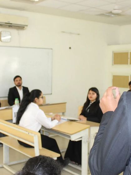 Another angle of the moot court session, showing the intensity and focus of both the student advocates and the judging panel.