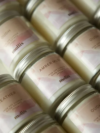An assortment of scents including Leather, Oudh, and Amber Musk were chosen for these favors.