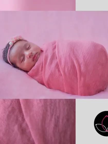 A classic newborn pose, with the baby swaddled tightly in a pink wrap, looking like a perfect, tiny bundle.