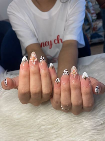 Both hands together, showcasing the full effect of this trendy and detailed nail art set.