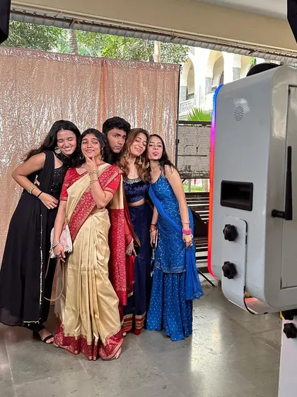 A group of friends making memories at their college's Traditional Day event.