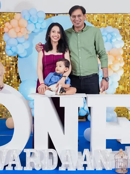 A classic family portrait from a teddy bear themed first birthday, capturing a beautiful memory for the family.