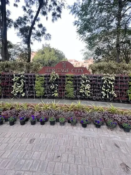 This large-scale vertical garden installation for Heritage City demonstrates our ability to execute complex public-facing projects. The design incorporates patterns and a variety of plants to create a landmark feature that enhances the community's entrance.