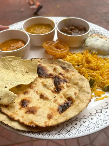 This is your plate at an event catered by me. I specialize in creating lavish North Indian and Continental buffet spreads that are packed with flavor. This plate features Veg Biryani, Dal Makhani, Paneer, Roti, and all the fixings for a truly satisfying meal.