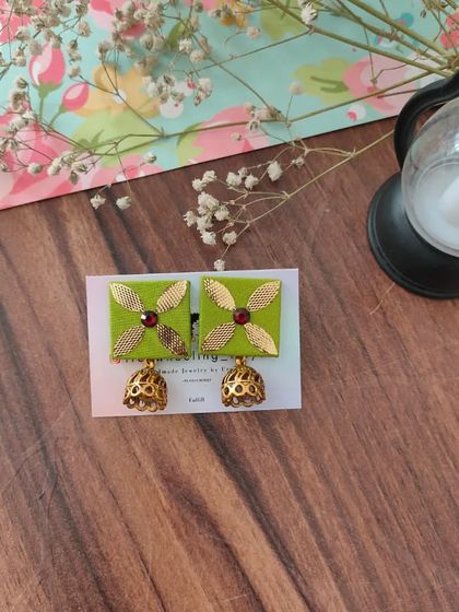 My gotapatti earrings are a festive favorite. These square fabric studs feature golden gotapatti work and a small jhumki drop, available in brown, green, and grey.