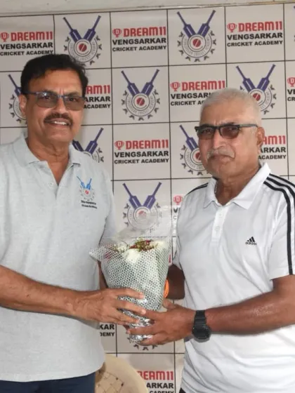 Presenting a bouquet to former cricketer Sanjay Gaitonde at the Dream11 Cup event.