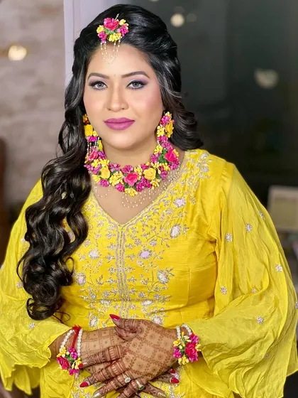 A bright and joyful shot of the bride, looking radiant and ready for her Haldi celebrations.