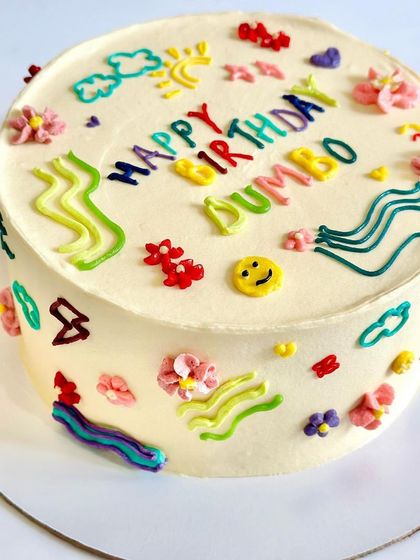 A fun doodle art cake covered in colorful, quirky drawings. This design is perfect for someone with a playful and artistic personality.