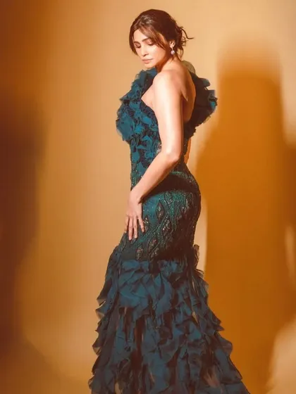 Bollywood star Daisy Shah styled in a dramatic teal ruffled gown by Anjum Qureshi for the HT City Style Icon Awards. This look is pure red carpet drama.