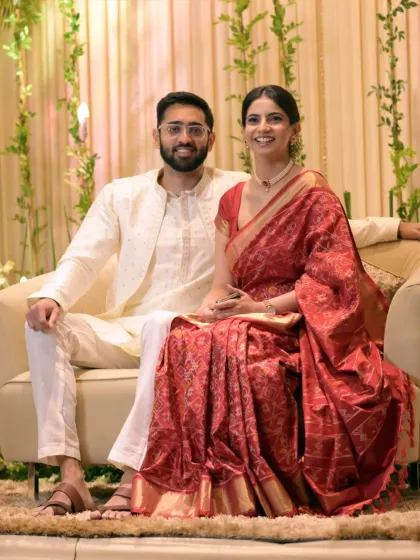 A classic posed portrait of the couple at their Roka ceremony, looking elegant in their traditional attire.