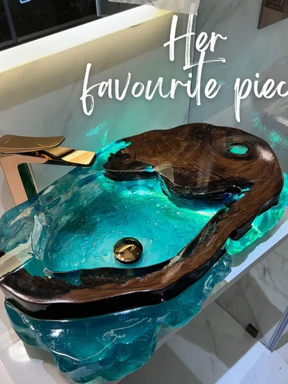 An image highlighting my favorite piece, the glowing resin washbasin. It's a perfect example of how functional items can be transformed into high-end art.