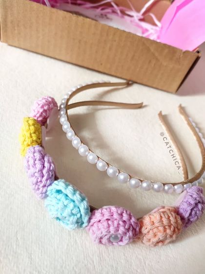 Another view of the floral and pearl tiara headband set, ready to be boxed. The pastel colors are perfect for parties and special occasions.
