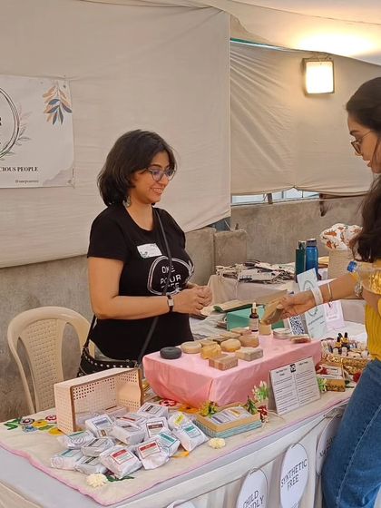 A customer making a selection at my stall.