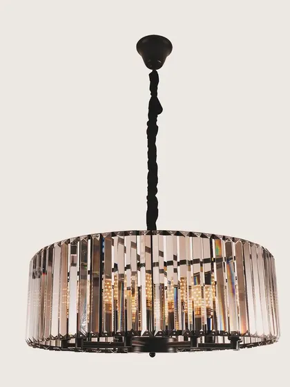 A drum chandelier with vertical crystal prisms. This design offers a clean, modern silhouette while still providing the classic sparkle of crystal.