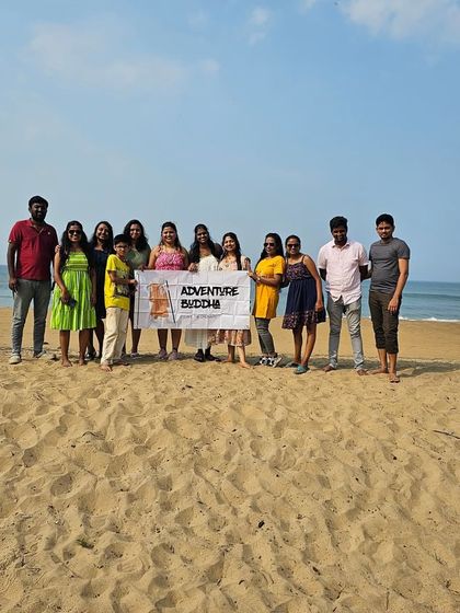 The tribe on the beach in Gokarna, holding our banner high. Sun, sand, and new friends make for a perfect weekend.
