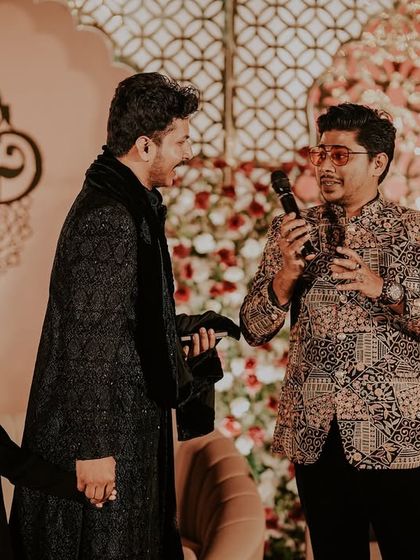 Another shot from the reception of Aqib and Alisha. Here I am interacting with the groom and a young family member, ensuring everyone feels part of the celebration.