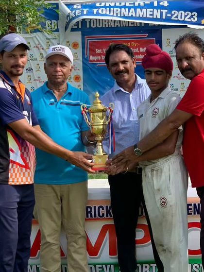 The captain receiving the championship trophy. Leading a team to victory is a huge responsibility and a massive achievement for a young player.