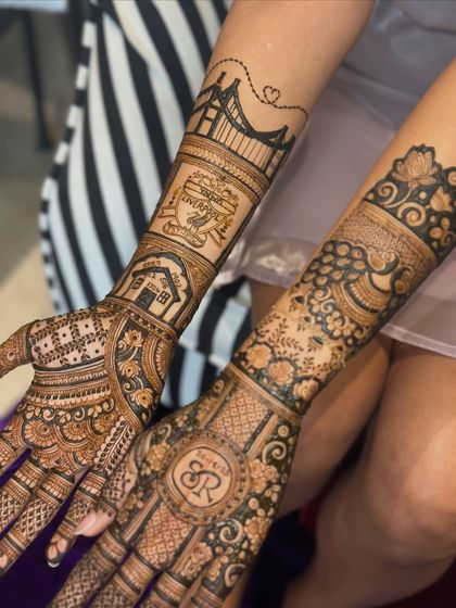 A closer look at the custom details, including the Liverpool FC logo and a drawing of the couple's home. Your hobbies and passions have a place in your bridal henna.