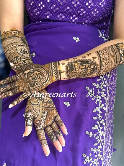 A full view of the engagement design, showing the balance between the personalized palms and patterned arms.