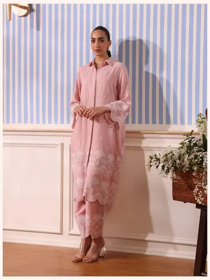 This pink co-ord set features a longline shirt and matching pants with beautiful embroidery. It’s an elegant and contemporary choice.