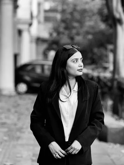 A black and white photo capturing a pensive mood. The path to justice can be challenging, but every obstacle overcome makes the victory sweeter.