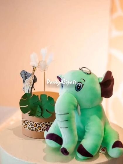 I love adding soft touches to the decor, like this cute plush elephant toy, which adds a playful and child-friendly element to the setup.