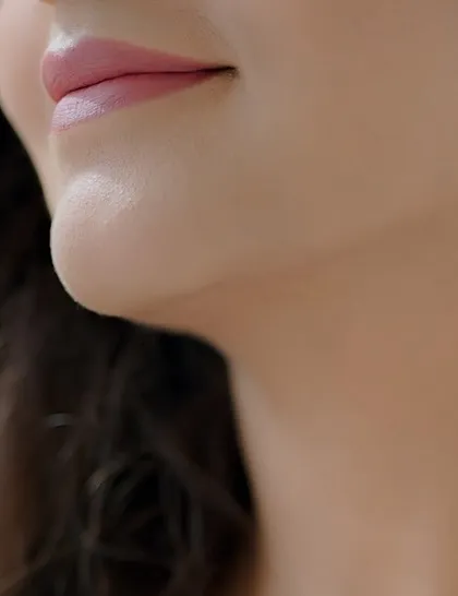 A close up on a perfectly applied soft pink lipstick. This demonstrates my focus on creating clean lines and a smooth finish for a polished look.