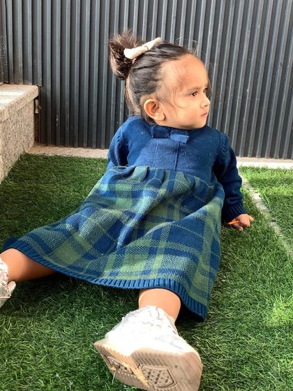My daughter enjoying the outdoors in her cozy winter dress from Firstcry. I always look for clothes that are both practical and pretty.