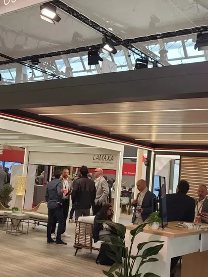 A look inside a beautifully designed expo booth featuring retractable roofs and comfortable outdoor furniture. This inspires us to think about the complete lifestyle our products enable.