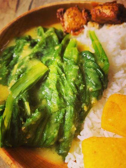 A close-up of the mustard leaves and dal, a common and comforting dish in many North-Eastern homes.
