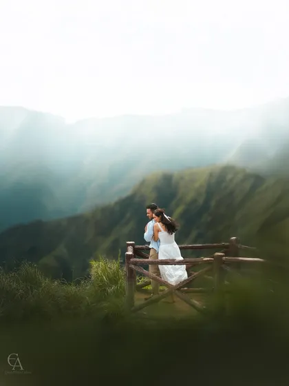 Standing together at a viewpoint, looking out at the endless layers of green hills. This scenic couple portrait is designed to show not just your connection, but also the beautiful journey that lies ahead of you.