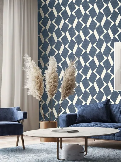 A bold, geometric pattern in shades of blue and white creates a dynamic and modern living space. This wallcovering is perfect for adding visual interest and a contemporary feel to any room.
