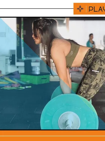 Strong girls rule. Here is one of our members performing a deadlift with perfect form. We focus on teaching correct techniques for strength training exercises to build real power and prevent injuries.