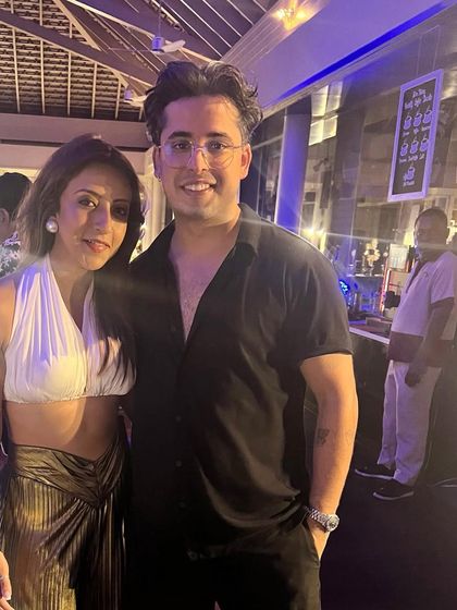 With a friend at the party. It's always fun to see how everyone interprets the party's dress code.