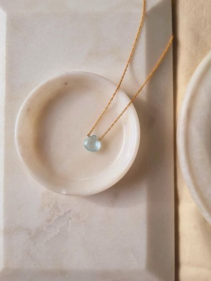 A simple, beautiful shot of the Aquamarine heart drop pendant. It's a perfect talisman for calm.