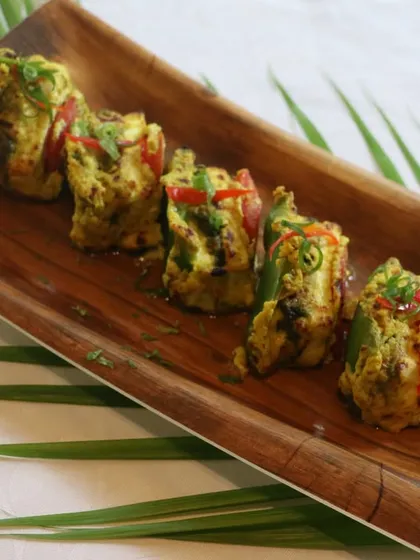 Another look at our Paneer Bharwan Tikka, served on a unique wooden platter. The presentation makes the dish even more appealing.