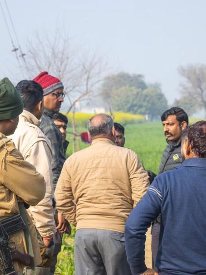 Forest department officials and villagers discussing the situation during the tiger rescue. Collaboration is key in these complex scenarios.