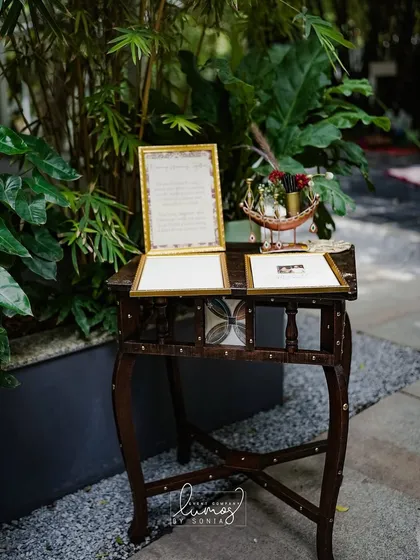 Another view of the memory-framing station, showcasing the elegant setup with vintage-style frames and pens.
