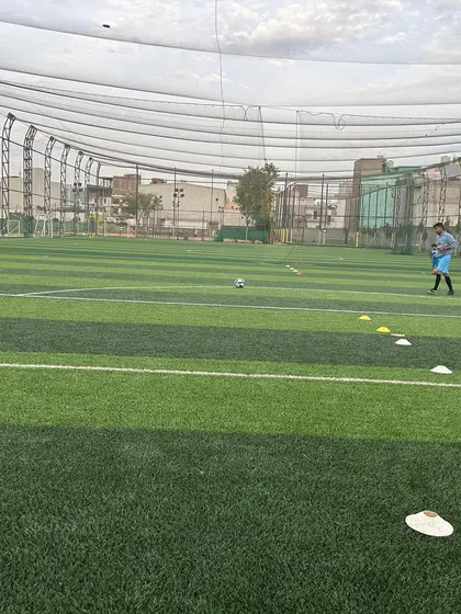 A player warming up on the new turf. Quality infrastructure is essential for quality training.