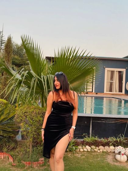 Posing by the pool at my birthday celebration. The outdoor setting is perfect for a summer party.