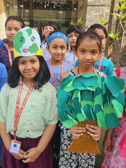 Students get creative with costumes for Earth Day, dressing up as a tree and the Earth to spread awareness in a fun and engaging way.