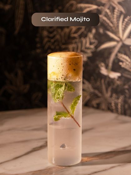 A Clarified Mojito, our modern take on a classic. By clarifying the ingredients, we create a crystal-clear mojito that's incredibly smooth and packed with minty flavour.