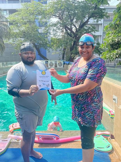 Another one of our dedicated students proudly displays her certificate of achievement. Each one represents a new level of skill and confidence gained through our structured program.