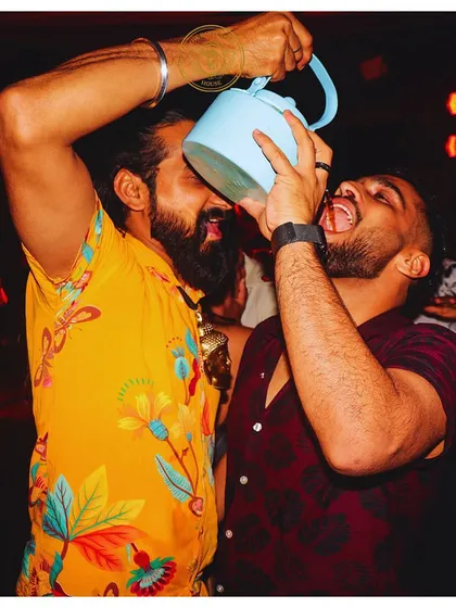 Sharing a drink in a unique way. We are all about creating fun, candid moments that capture the true spirit of your celebration.