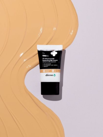 We love a good texture smear. This shot features a BB cream tube on a background of its own product, creating a visually interesting composition that is all about that smooth, creamy feel.