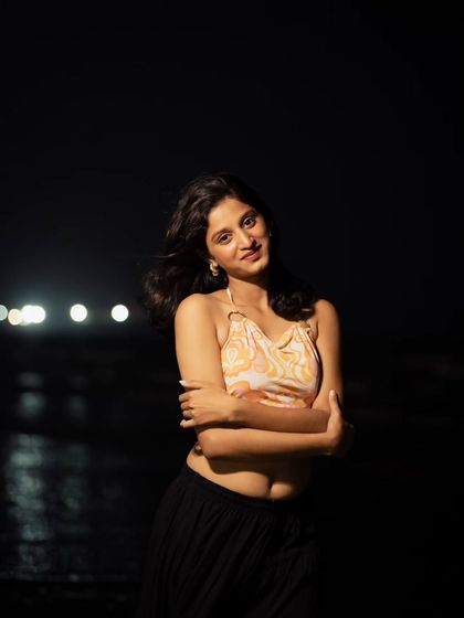 A smiling, happy shot that shows the versatility of night portraits. They don't always have to be serious; they can be joyful and full of life too.